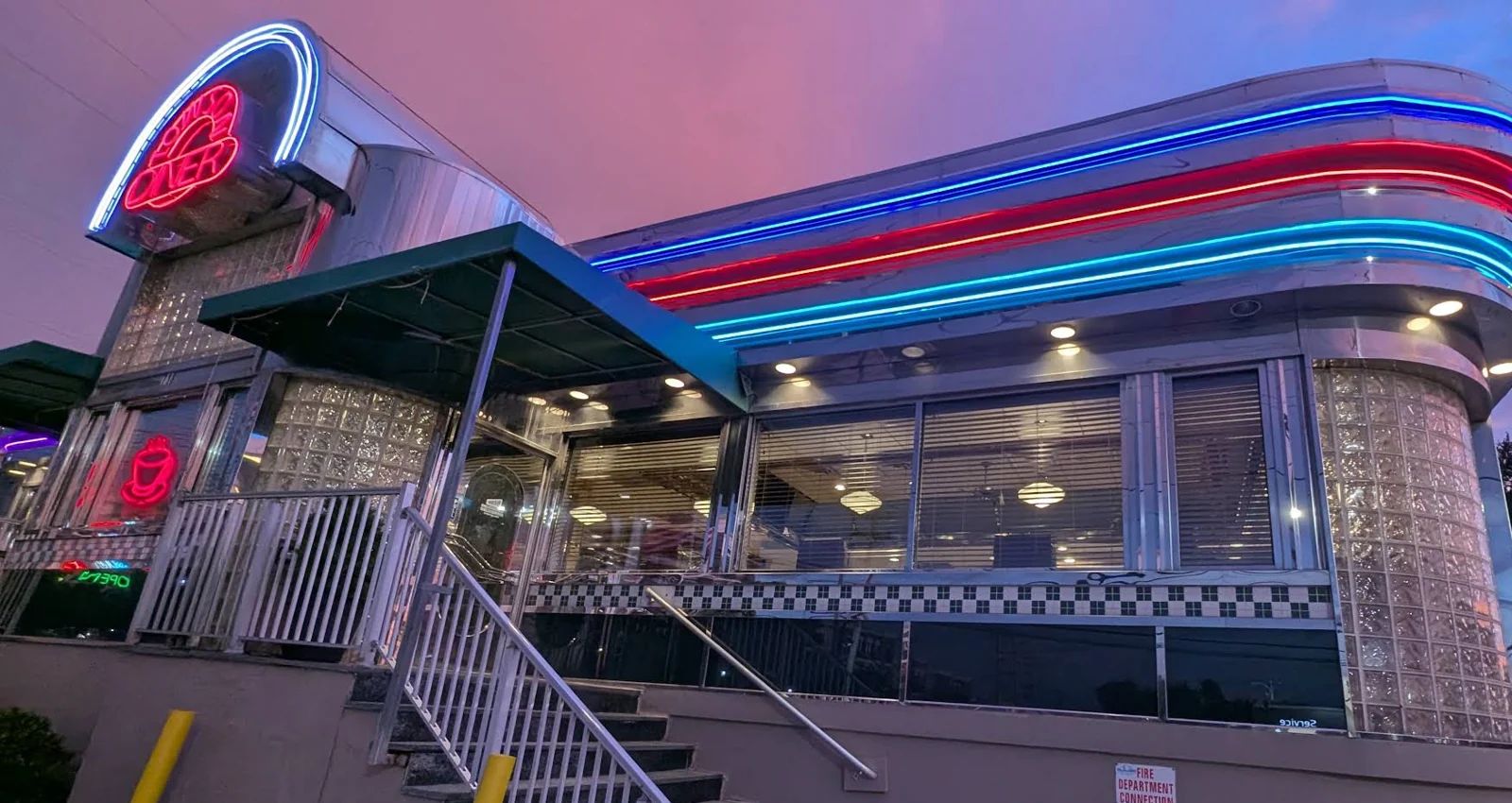 The neon-lit Towson Diner exterior at dusk